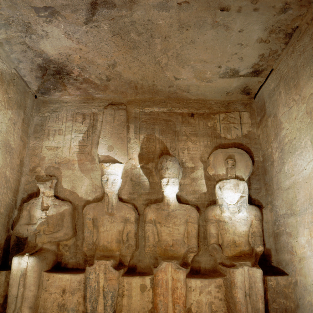 Abu_Simbel_temple,_four_statues_of_divinities_in_sanctuary.jpg
