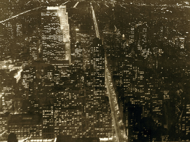 New York City by night view from The Empire State building, ca. 1930s.jpg